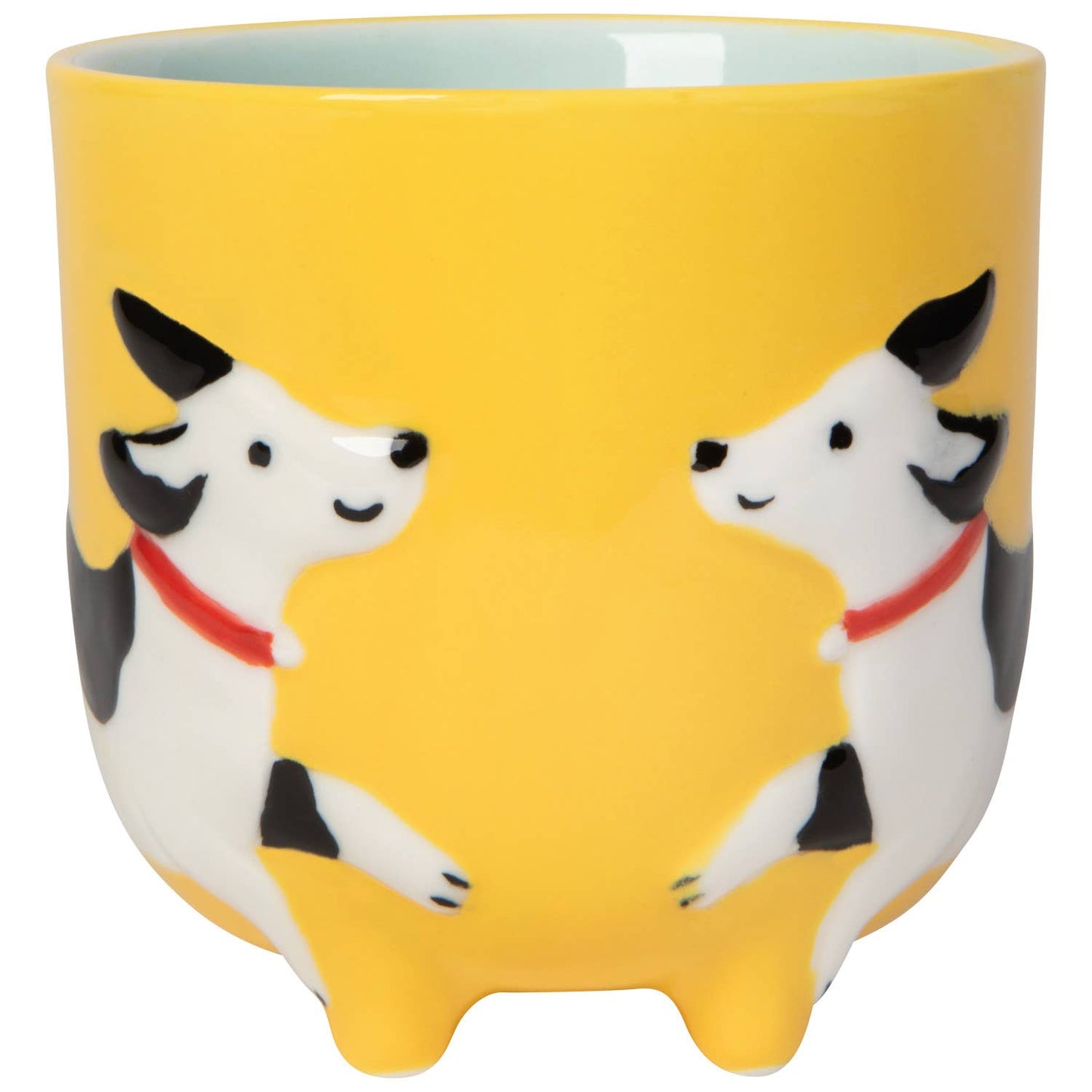 Yellow mug with black and white dog illustrations on a yellow background