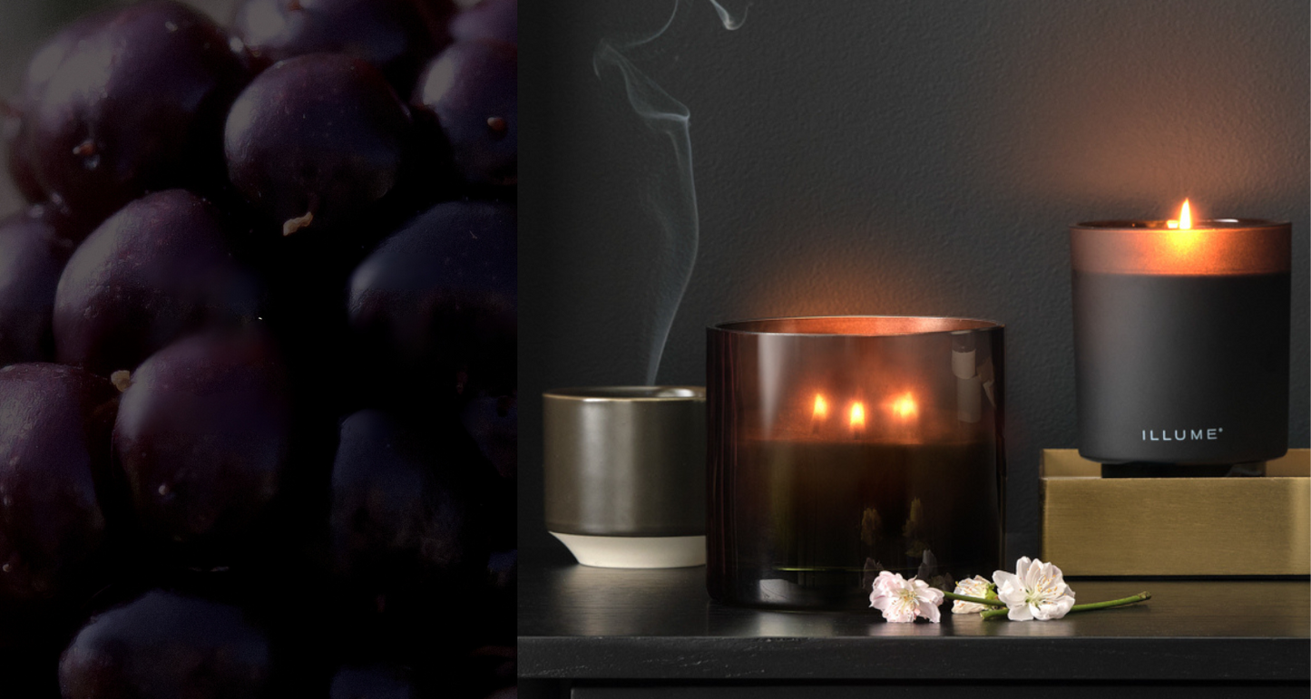 3 lit candles with blackberries in the photo