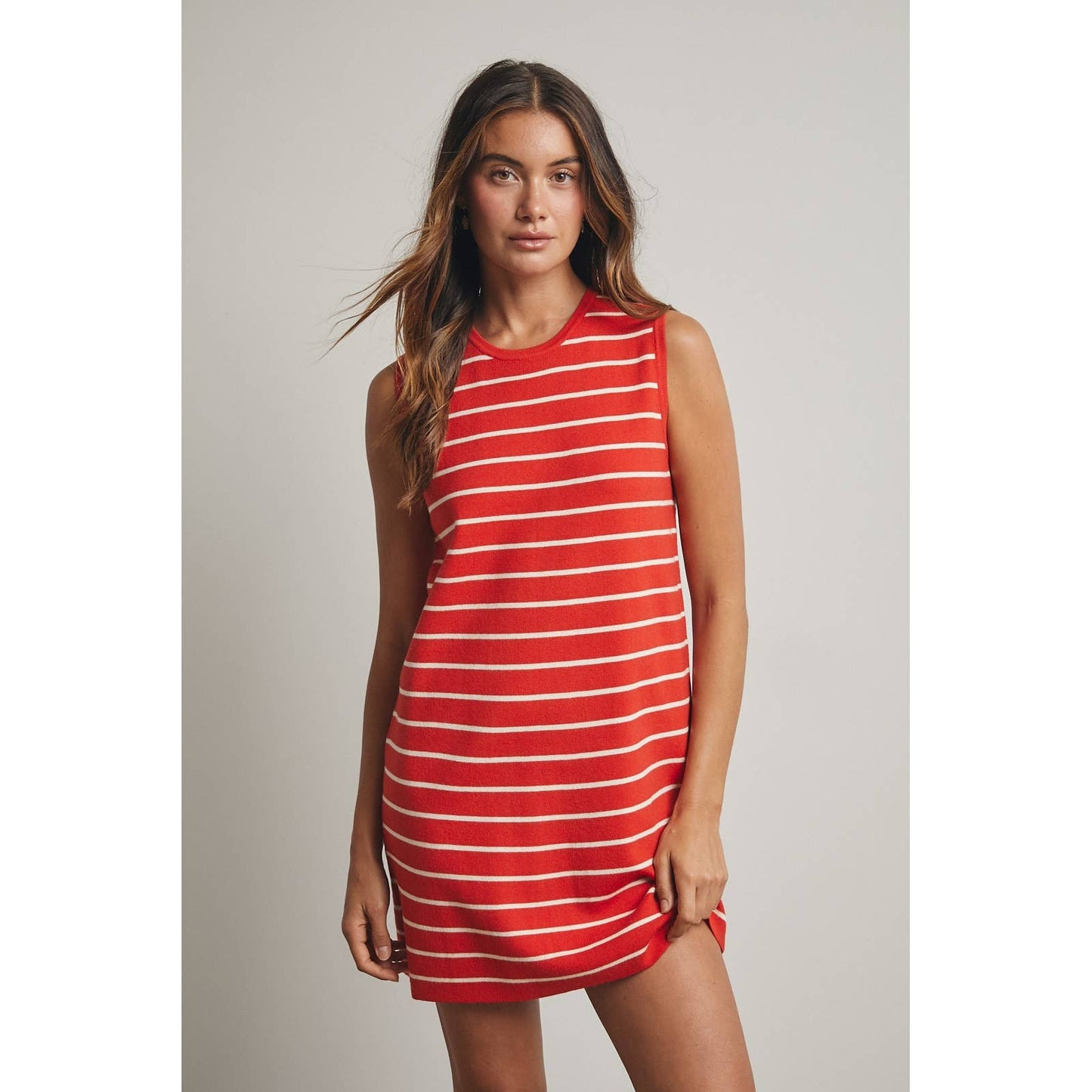 Woman wearing a red and white striped dress 