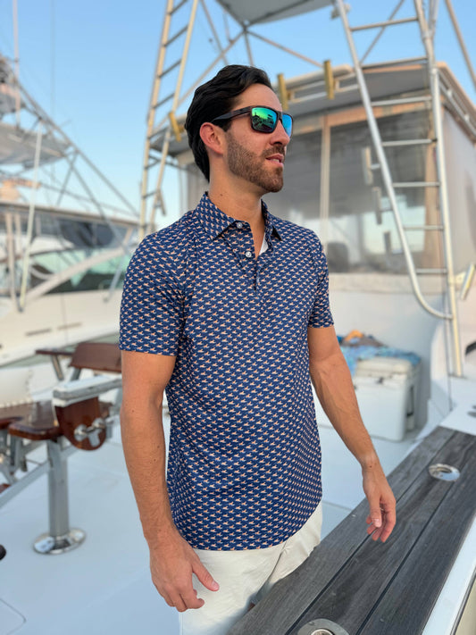 Man wearing a blue patterned shirt on a boat