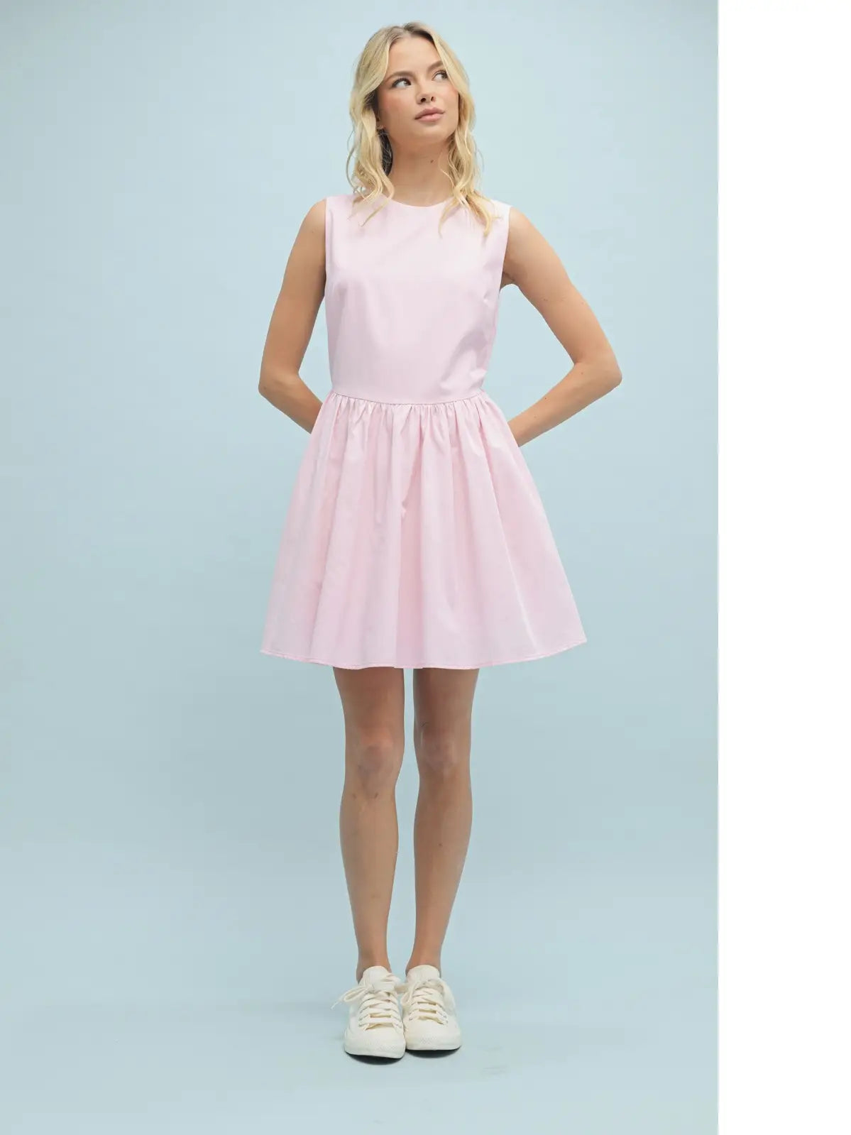 Woman wearing a light pink dress