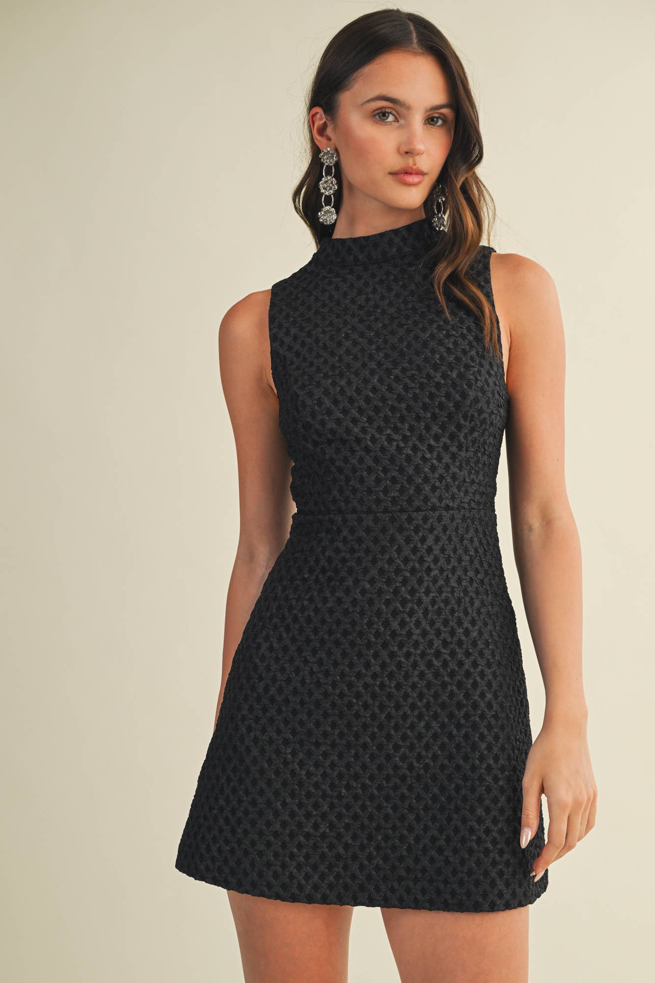 Woman wearing a black patterned dress 