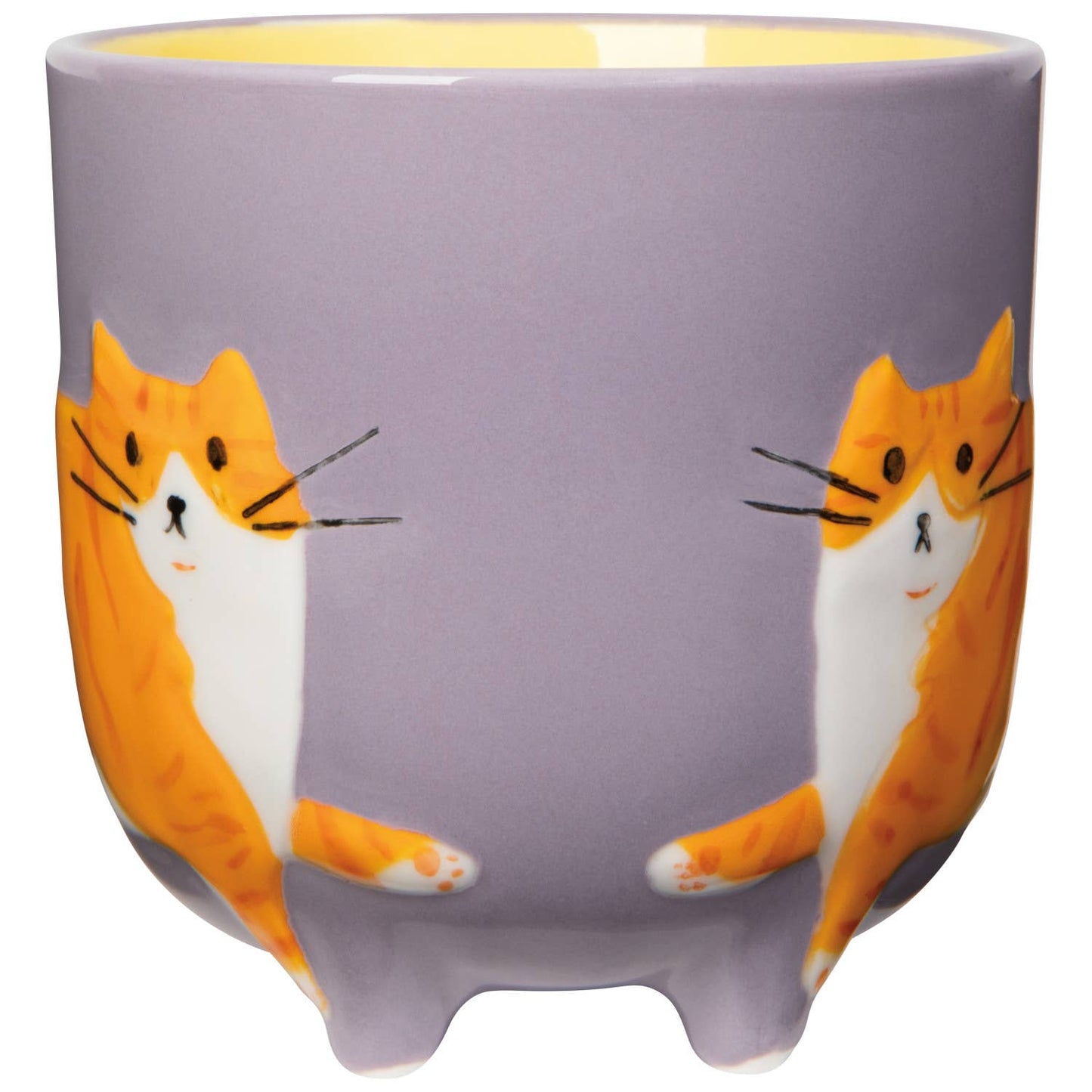 Ceramic mug with cat design on a purple background