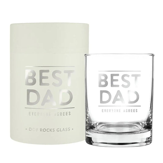Clear glass tumbler with 'Best Dad' text next to a white box on a white background