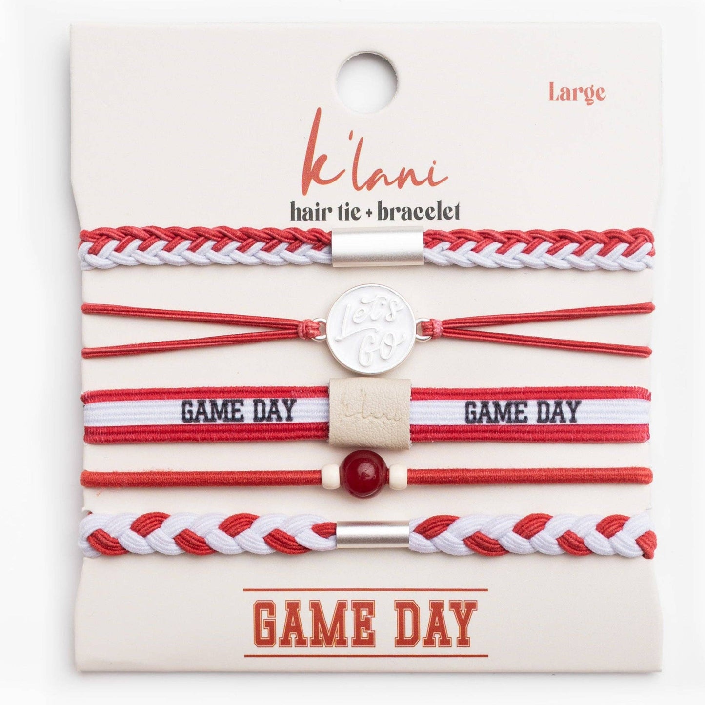 Set of red and white hair ties and bracelets on a 'káóliá' branded card.