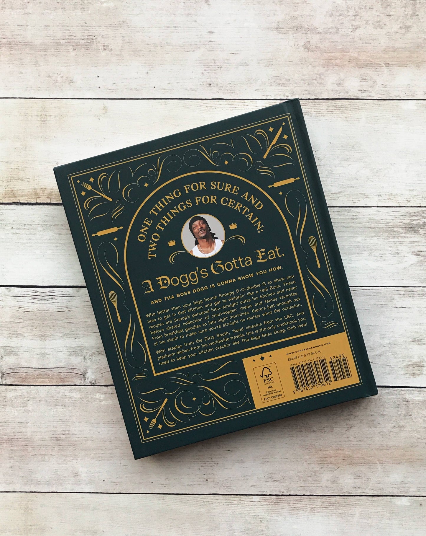 Book or box with decorative text and a barcode on a wooden surface