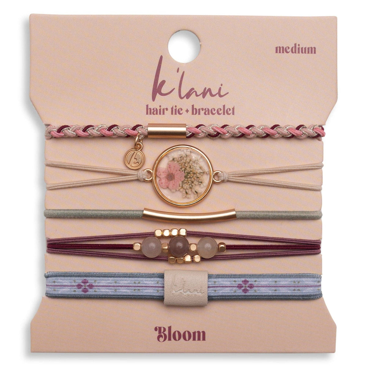 Set of hair tie-bracelets on a 'Bloom' branded card with 'kéülani' branding.