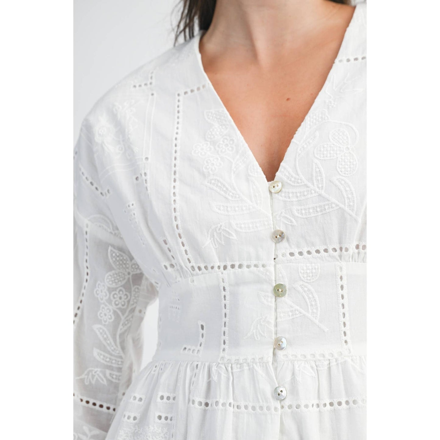 White dress with intricate cut-out patterns 