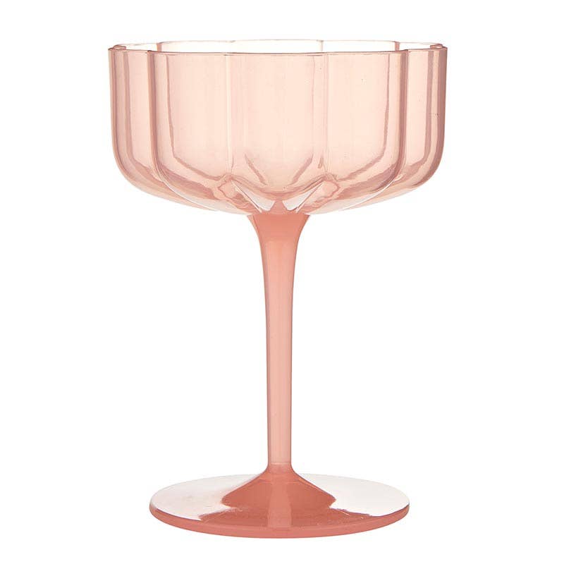 Pink glass with a fluted design on a white background