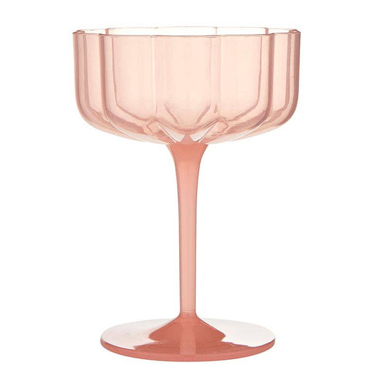 Pink glass with a fluted design on a white background