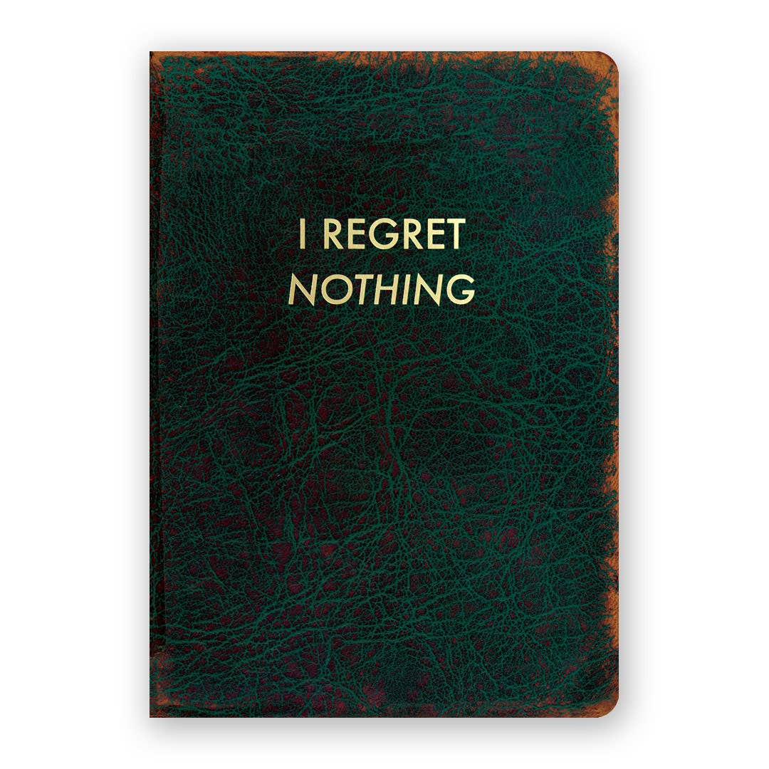 Green leather notebook with 'I Regret Nothing' text on a white background