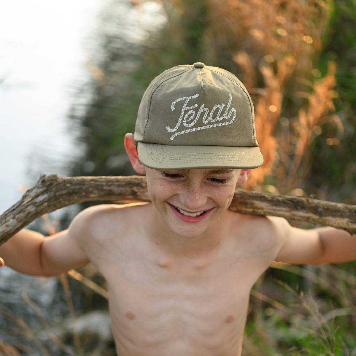 young boy wearing Kids Feral Snapback Hat