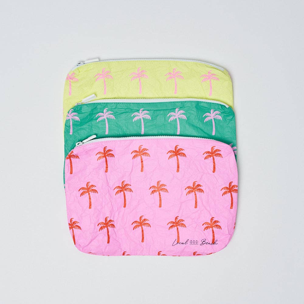 Pouch with palm tree pattern on a light gray background