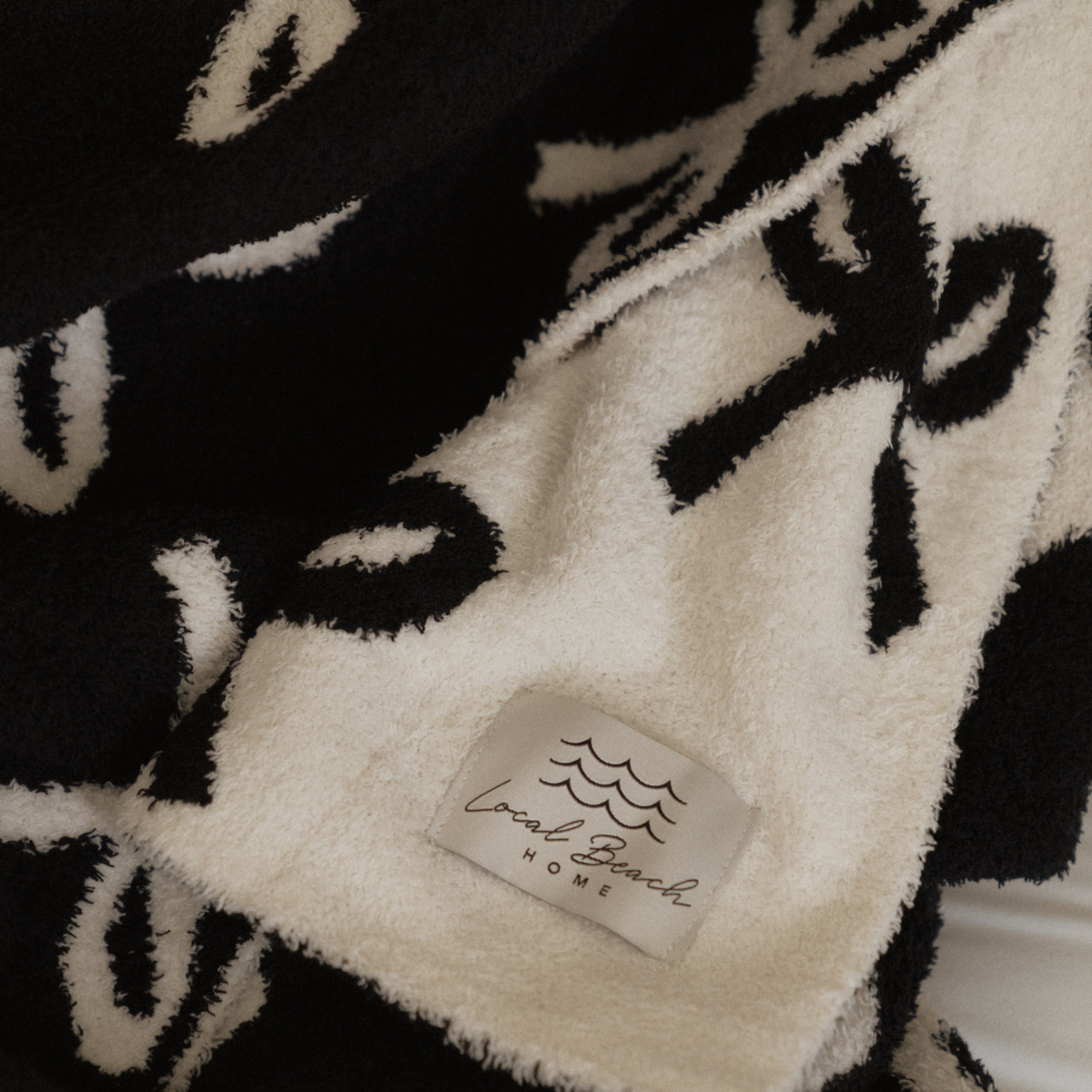 local beach Bow Luxe Home Blanket: Cream/Sand